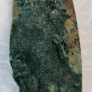 Glittery rough malachite cabochon healing stone at the Rock Shop