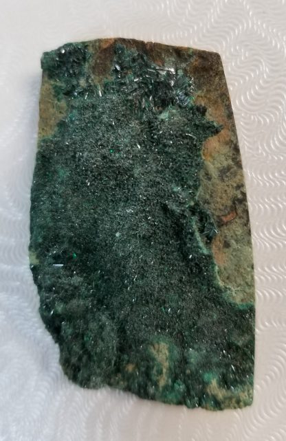 Glittery rough malachite cabochon healing stone at the Rock Shop